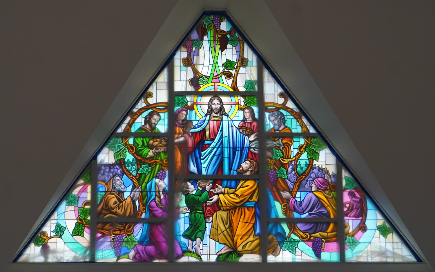This newly created stained-glass window (partially covered in clear plastic for protection), depicting Jesus feeding the 5,000, is one of three that have been installed in the Cathedral of St. Joseph in Jefferson City as part of an extensive renovation, expansion and upgrade of the 54-year-old Cathedral. An additional nine windows are scheduled to be installed by year’s end.